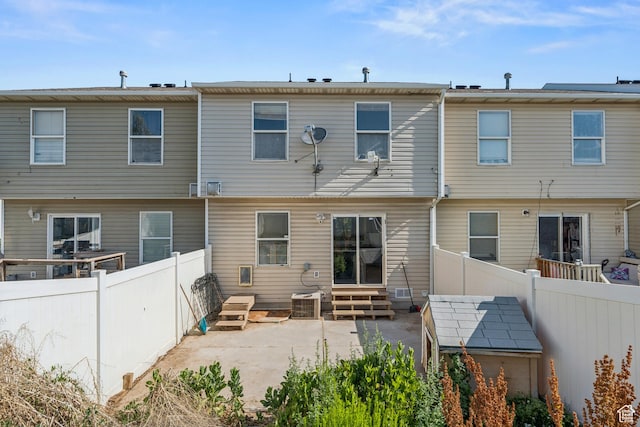 1791 W 5125 S, Roy, UT 84067 - rear view of property featuring a patio, entry steps, and a fenced backyard