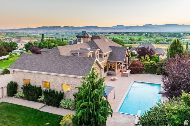694 W Cephus Rd, Draper, UT 84020 - aerial view at dusk of a mountain view and view of pool area