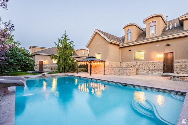 694 W Cephus Rd, Draper, UT 84020 - view of pool with a water slide, a gazebo, and a patio area