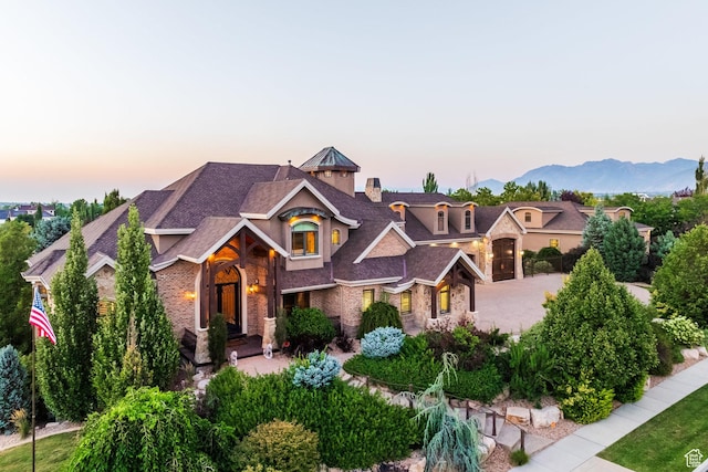 694 W Cephus Rd, Draper, UT 84020 - view of front of house featuring stone siding, a chimney, and roof with shingles