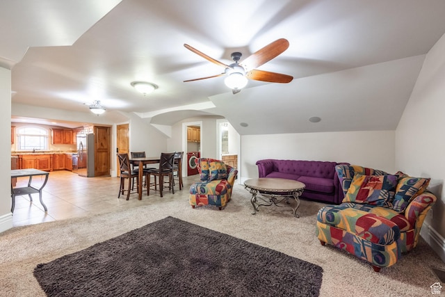 694 W Cephus Rd, Draper, UT 84020 - living room with light colored carpet, vaulted ceiling, and a ceiling fan