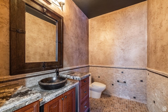 694 W Cephus Rd, Draper, UT 84020 - bathroom with vanity, wainscoting, and a textured wall