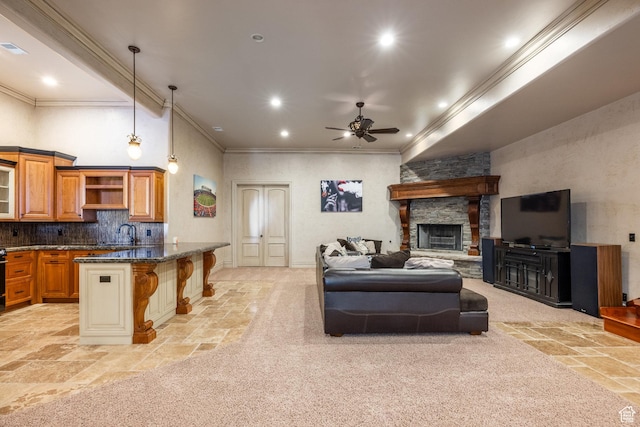 694 W Cephus Rd, Draper, UT 84020 - living area with stone tile floors, ceiling fan, recessed lighting, ornamental molding, and a stone fireplace