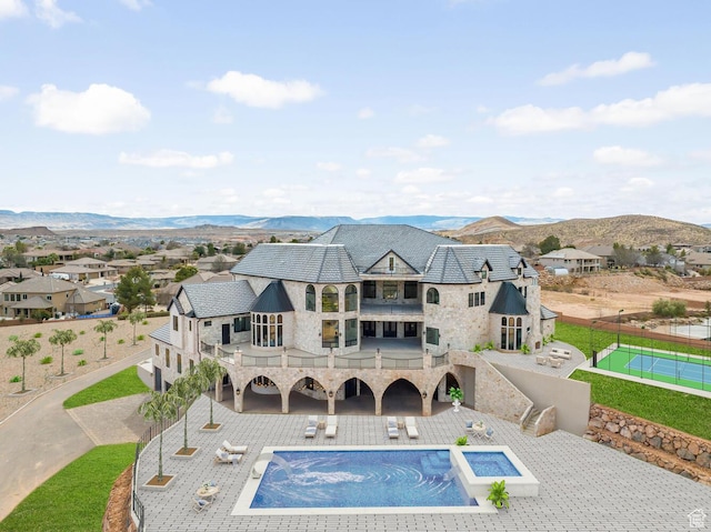 2836 S 2300th Cir E, St George, UT 84790 - back of property featuring a balcony, stone siding, a mountain view, a patio, and stairway
