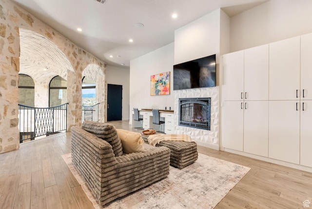 2836 S 2300th Cir E, St George, UT 84790 - living area with a tile fireplace, light wood finished floors, and recessed lighting