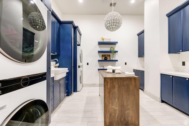2836 S 2300th Cir E, St George, UT 84790 - laundry room with stacked washing machine and dryer, cabinet space, light wood finished floors, and recessed lighting