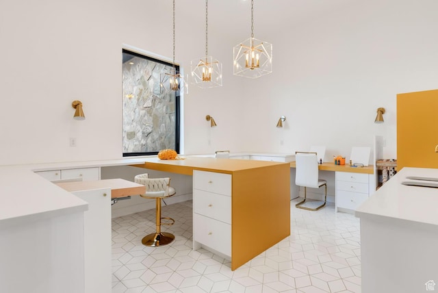 2836 S 2300th Cir E, St George, UT 84790 - home office with a chandelier, built in desk, and light tile patterned floors