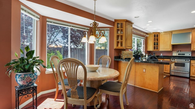 2262 E Emerald Hills Ct, Cottonwood Heights, UT 84121 - kitchen with gas range, a chandelier, glass insert cabinets, dark countertops, and dark wood-style flooring