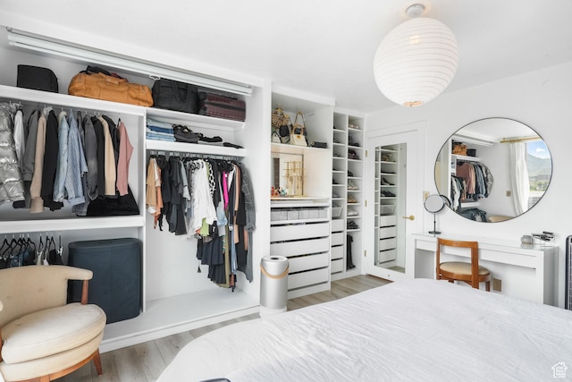 777 E S Temple S Unit 15E, Salt Lake City, UT 84102 - bedroom featuring a closet and wood finished floors