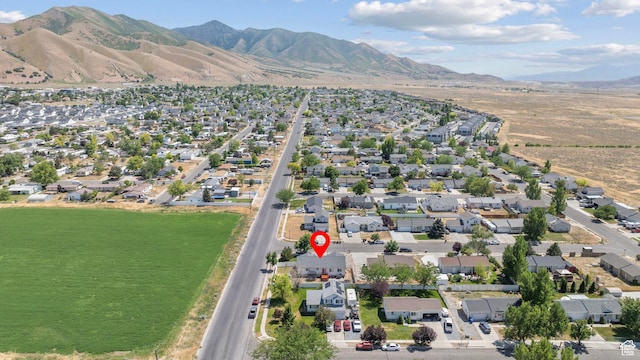 918 W 340 S, Tooele, UT 84074 - aerial overview of property's location with a mountain backdrop and nearby suburban area
