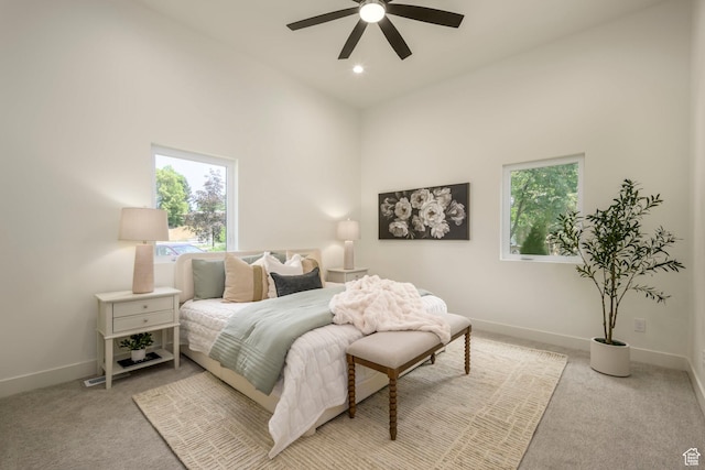 1958 E Longview Dr, Holladay, UT 84124 - bedroom featuring multiple windows, light colored carpet, a towering ceiling, ceiling fan, and recessed lighting