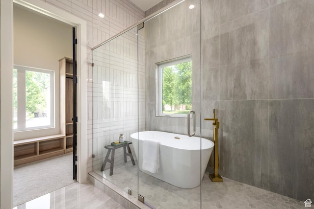 1958 E Longview Dr, Holladay, UT 84124 - full bath featuring healthy amount of natural light, a stall shower, a freestanding tub, and tile walls