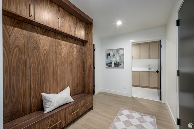 1958 E Longview Dr, Holladay, UT 84124 - mudroom featuring baseboards and light wood-style flooring