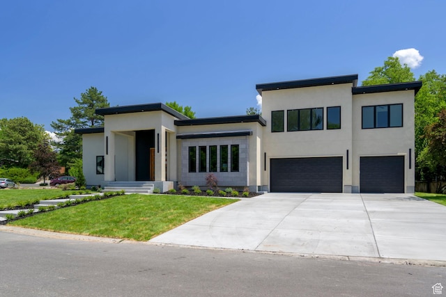 1958 E Longview Dr, Holladay, UT 84124 - modern home featuring an attached garage, concrete driveway, a front yard, and stucco siding