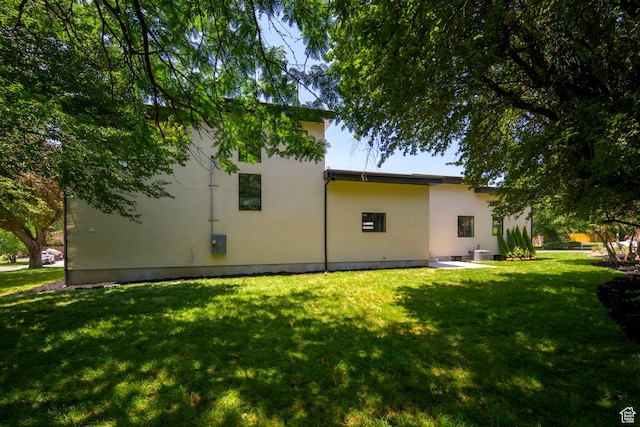 1958 E Longview Dr, Holladay, UT 84124 - rear view of house with a lawn and stucco siding