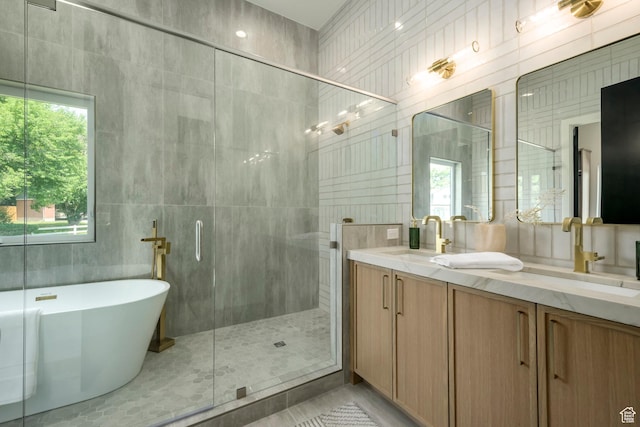 1958 E Longview Dr, Holladay, UT 84124 - bathroom with a stall shower, a soaking tub, tile walls, double vanity, and tile patterned floors