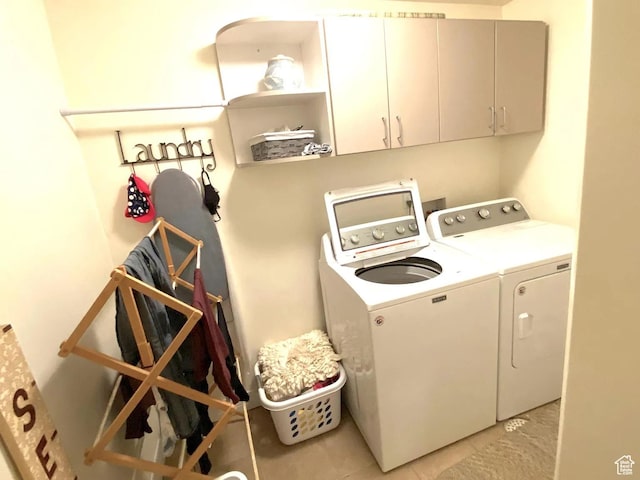4854 N Shady Bend Ln, Lehi, UT 84043 - laundry room with cabinet space, washing machine and clothes dryer, and light tile patterned floors