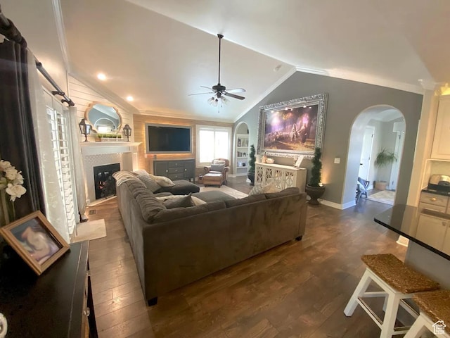 4854 N Shady Bend Ln, Lehi, UT 84043 - living area featuring arched walkways, a ceiling fan, ornamental molding, lofted ceiling, and a fireplace