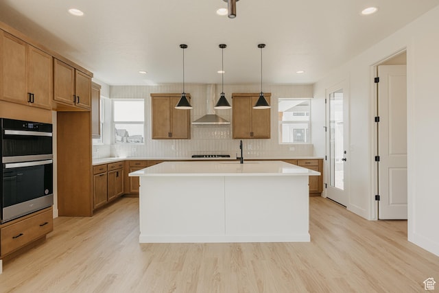 1026 W Chokecherry Dr Unit 135, Mapleton, UT 84664 - kitchen featuring wall chimney exhaust hood, stainless steel double oven, brown cabinetry, light countertops, and recessed lighting