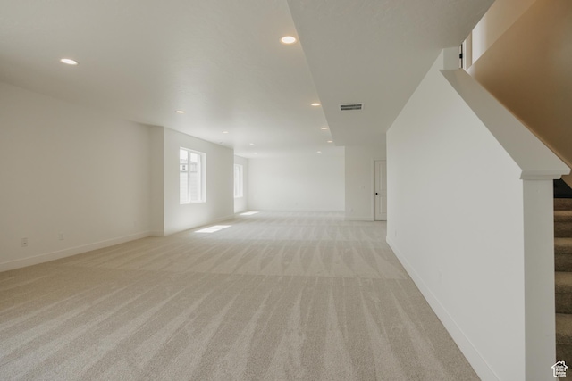 1026 W Chokecherry Dr Unit 135, Mapleton, UT 84664 - unfurnished living room with light colored carpet, recessed lighting, and stairway