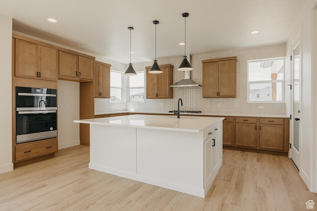 1026 W Chokecherry Dr Unit 135, Mapleton, UT 84664 - kitchen featuring brown cabinets, double oven, light countertops, tasteful backsplash, and recessed lighting