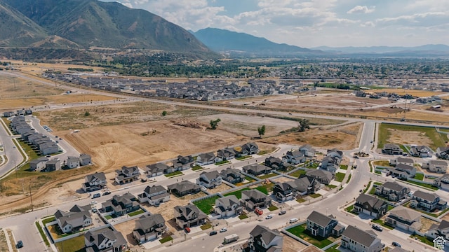 1026 W Chokecherry Dr Unit 135, Mapleton, UT 84664 - aerial view of property and surrounding area with a mountainous background and nearby suburban area