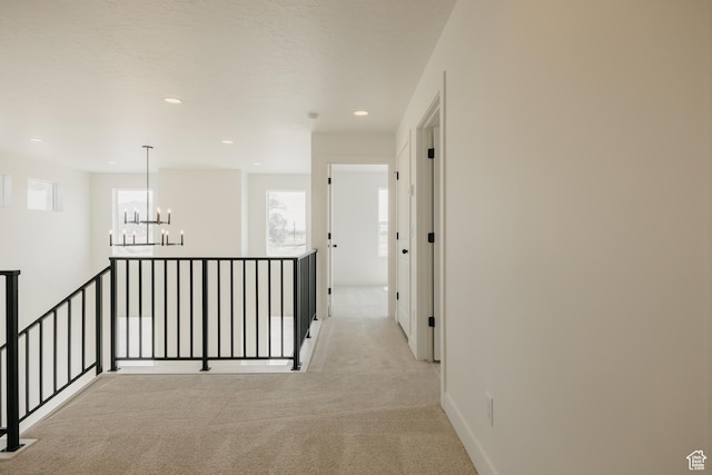 1026 W Chokecherry Dr Unit 135, Mapleton, UT 84664 - hallway with a chandelier, light carpet, recessed lighting, and an upstairs landing