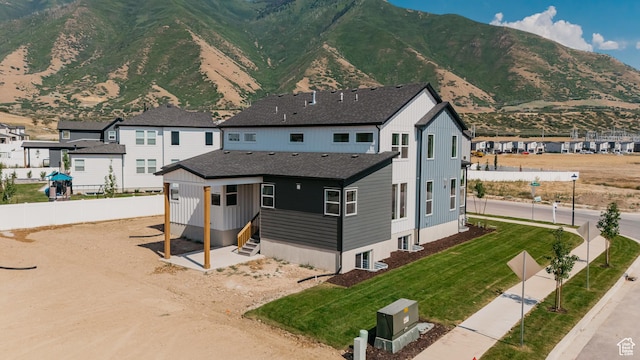 1026 W Chokecherry Dr Unit 135, Mapleton, UT 84664 - view of front of property with a mountain view, a residential view, and a shingled roof