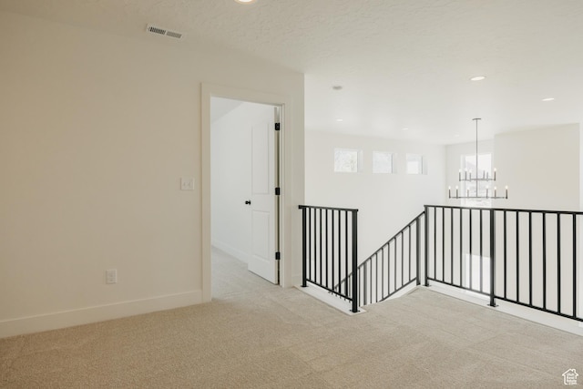 1026 W Chokecherry Dr Unit 135, Mapleton, UT 84664 - spare room with a chandelier, carpet flooring, and recessed lighting