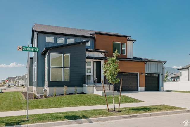 1026 W Chokecherry Dr Unit 135, Mapleton, UT 84664 - contemporary house with concrete driveway, an attached garage, and board and batten siding