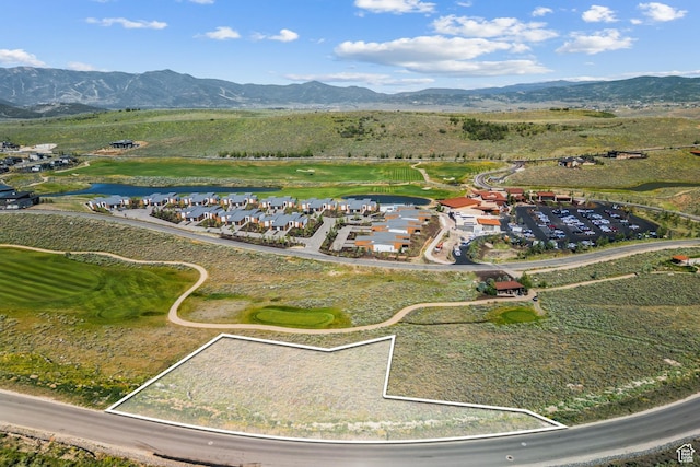 6033 Golf Clb Unit 5, Park City, UT 84098 - aerial view of property and surrounding area with a mountain backdrop, property boundaries highlighted, and a golf course