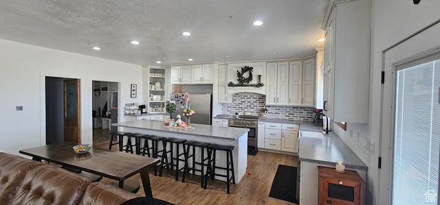 1275 S Lawrence Rd, Huntington, UT 84528 - kitchen featuring appliances with stainless steel finishes, wood finished floors, open shelves, tasteful backsplash, and recessed lighting