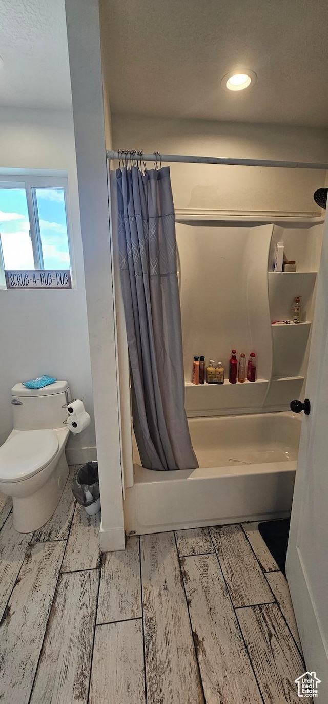 1275 S Lawrence Rd, Huntington, UT 84528 - bathroom with shower / bath combo with shower curtain, wood finished floors, recessed lighting, and a textured ceiling