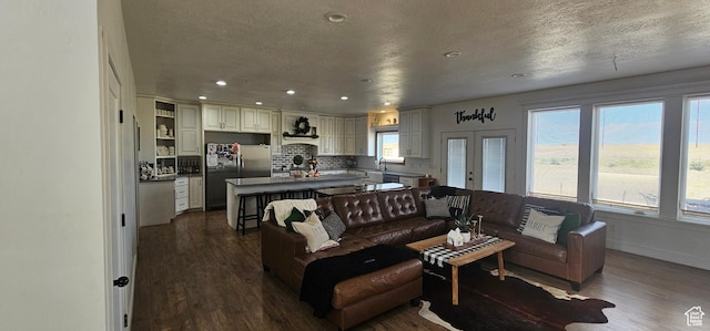 1275 S Lawrence Rd, Huntington, UT 84528 - living area with dark wood-style floors, recessed lighting, a textured ceiling, and french doors