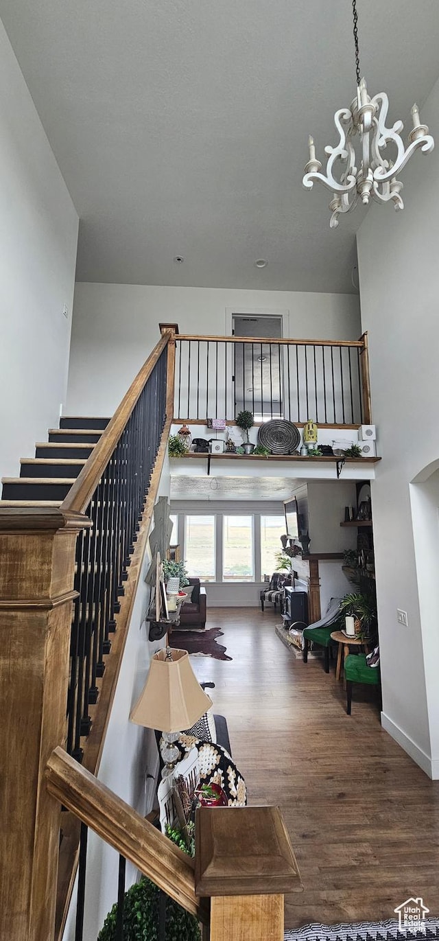 1275 S Lawrence Rd, Huntington, UT 84528 - stairway featuring wood finished floors and a chandelier