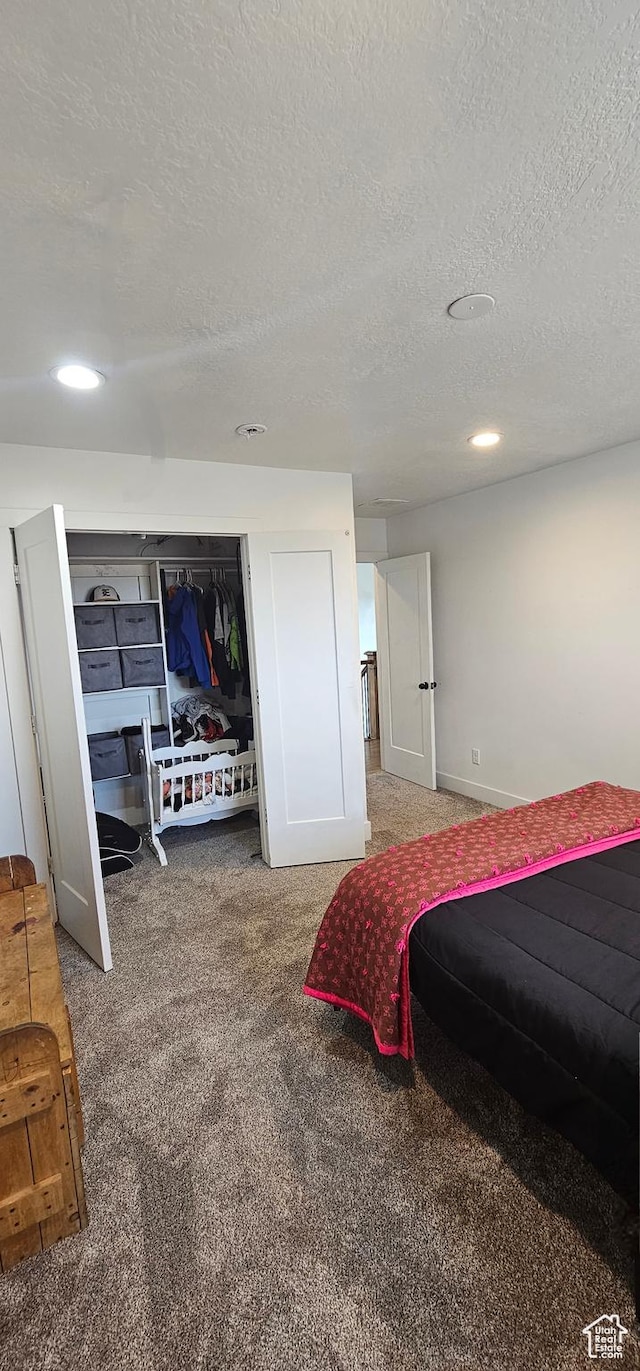 1275 S Lawrence Rd, Huntington, UT 84528 - carpeted bedroom featuring a textured ceiling and recessed lighting