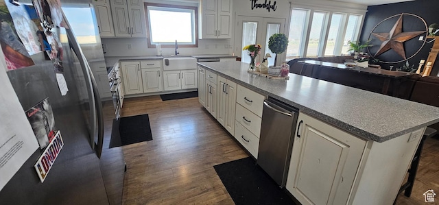 1275 S Lawrence Rd, Huntington, UT 84528 - kitchen featuring freestanding refrigerator, dark wood finished floors, and white cabinetry