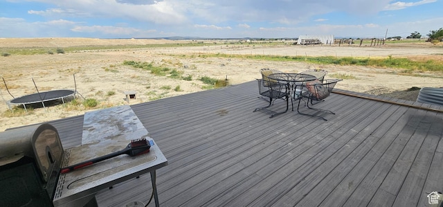 1275 S Lawrence Rd, Huntington, UT 84528 - wooden deck with a trampoline, a view of rural / pastoral area, and outdoor dining area