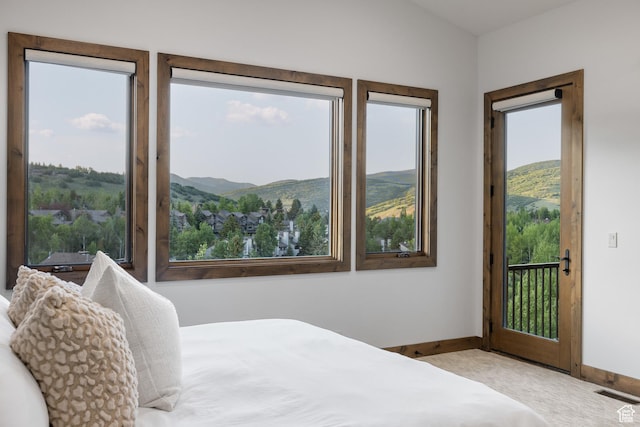 4014 W Hidden Cv Unit 11, Park City, UT 84098 - carpeted bedroom with access to exterior and a mountain view