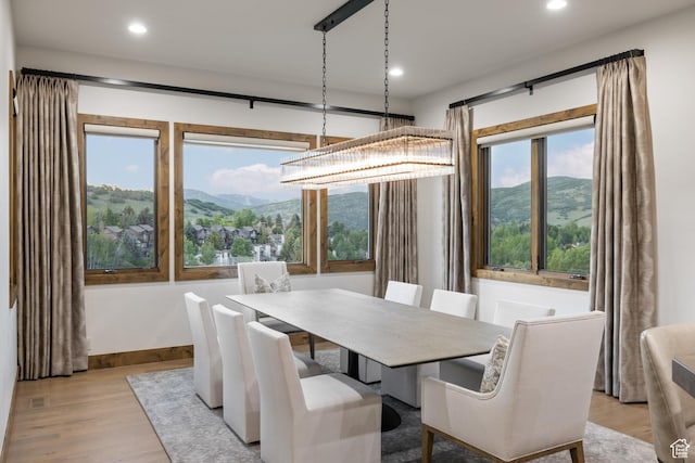 4014 W Hidden Cv Unit 11, Park City, UT 84098 - dining space with wood finished floors, a mountain view, and recessed lighting