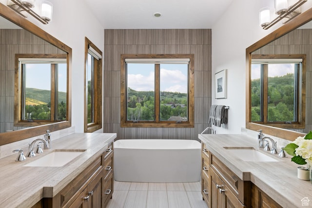 4014 W Hidden Cv Unit 11, Park City, UT 84098 - bathroom with a freestanding tub, two vanities, and tile patterned floors