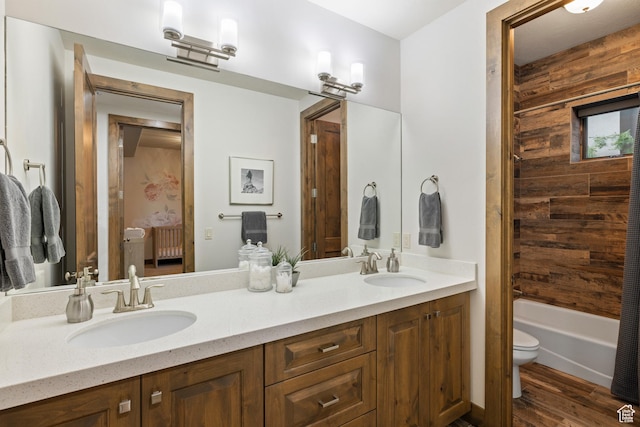 4014 W Hidden Cv Unit 11, Park City, UT 84098 - bathroom with wood walls, double vanity, wood finished floors, and tub / shower combination