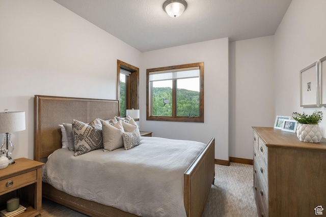 4014 W Hidden Cv Unit 11, Park City, UT 84098 - bedroom featuring baseboards and light colored carpet