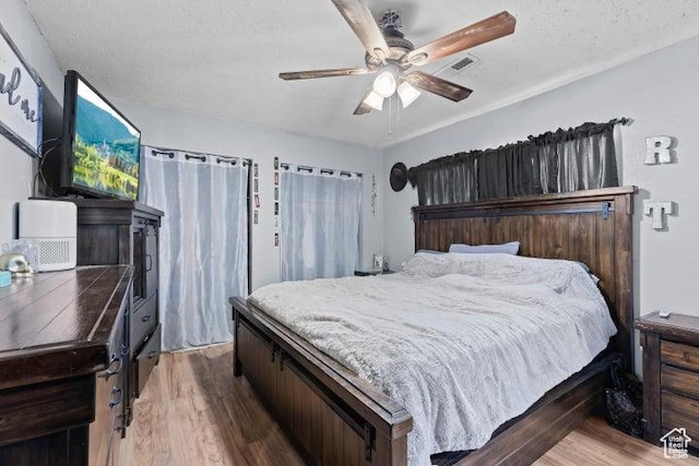 246 S 475 E, Enterprise, UT 84725 - bedroom with wood finished floors, ceiling fan, and a textured ceiling