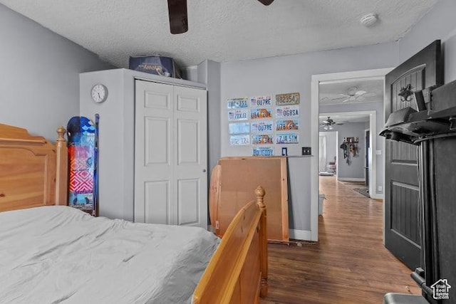 246 S 475 E, Enterprise, UT 84725 - bedroom featuring a textured ceiling, a closet, dark wood-style flooring, and a ceiling fan