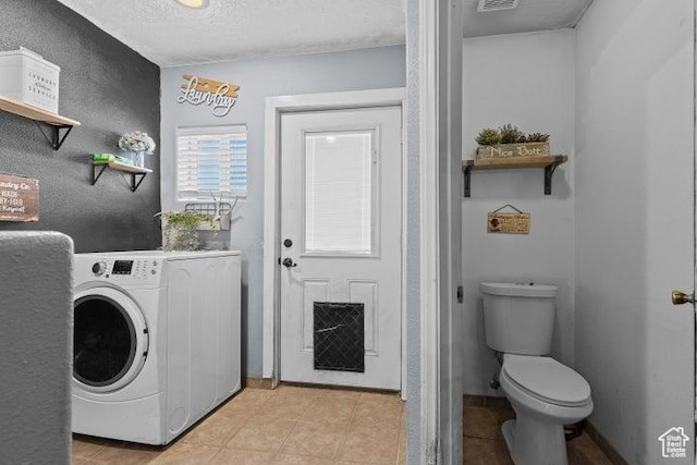 246 S 475 E, Enterprise, UT 84725 - laundry room featuring washer / dryer, a textured ceiling, and light tile patterned floors