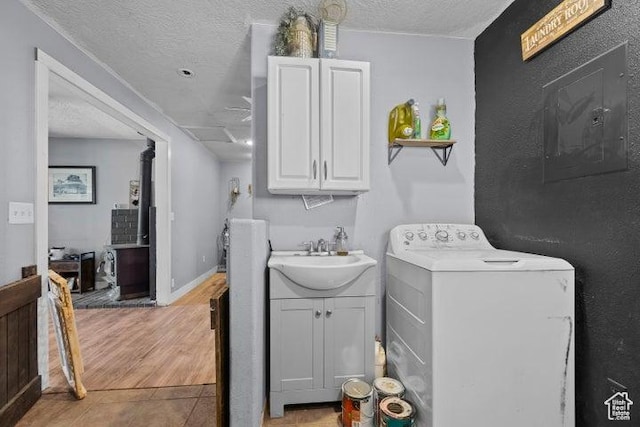 246 S 475 E, Enterprise, UT 84725 - laundry area featuring washer / clothes dryer, a textured ceiling, and cabinet space