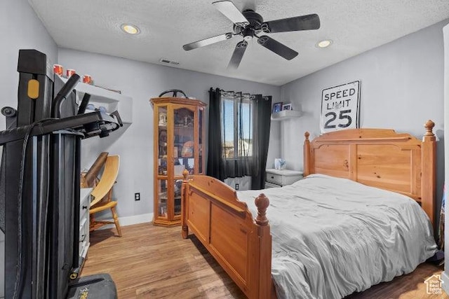 246 S 475 E, Enterprise, UT 84725 - bedroom featuring light wood-style flooring, a textured ceiling, ceiling fan, and recessed lighting