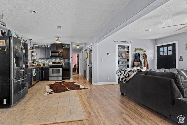 246 S 475 E, Enterprise, UT 84725 - living room featuring a textured ceiling, light wood-style floors, and ceiling fan