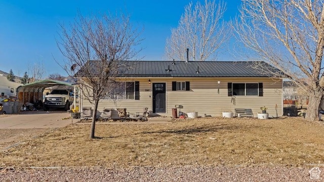 246 S 475 E, Enterprise, UT 84725 - view of front of house featuring a detached carport, a front yard, and a metal roof